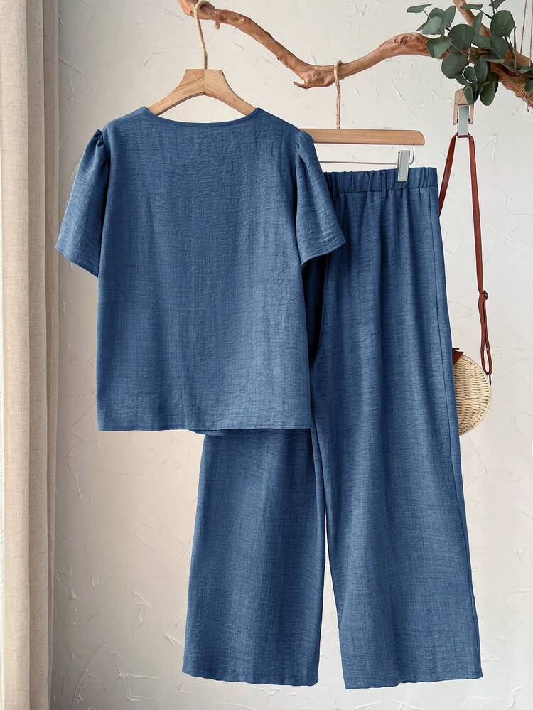 Plus Size Women's Summer Casual Vacation Country  Pleated Short Sleeve Solid Blue Shirt And Pants 2-Piece Set,2pc Set Plus Size Women's Summer Casual Vacation Country Pleated Round Neck Short Sleeve Solid Color Blue Shirt And Pants 2-Piece Set, Spring/Summer,Summer Holiday,Spring Break Outfits ,Vacation Outfits Women ,Holiday Outfits For Women,Going Out Outfits,2026 New Clothes,Simple And Fashionable For Everyday Wear, Green Two Piece Set, Modest Two Piece Set, Plus Size Summer Sets, Wide Leg Pants Set, Plus Size Pants Set,Suitable For Summer, Vacation, Commute, Daily Wear, Summer Outfits,Vacation, Daily Wear, Festival Outfits For Women,Country Concert Outfit,Beach Outfits For Women,Western Style