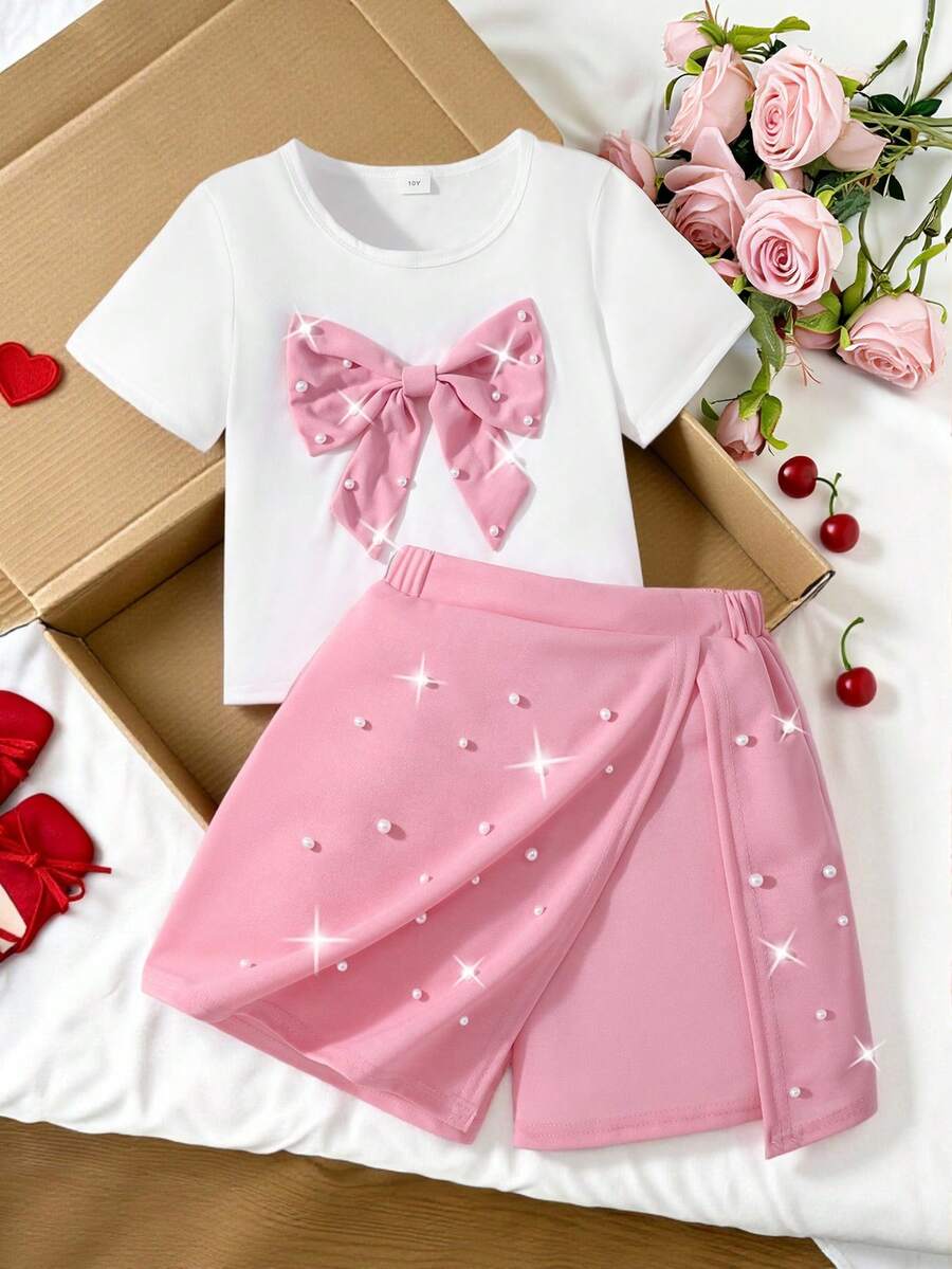 Conjunto de verano dulce y enérgico para niñas preadolescentes, camiseta de manga corta bicolor roja y blanca con gran lazo y decoración de perlas falsas + pantalones falda asimétrica, adecuado para salidas, actuaciones, citas - Rosa - Ver 1