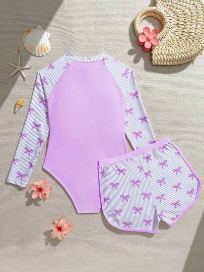 SHEIN Bộ đồ bơi thời trang mới cho bé gái tuổi teen, đồ bơi liền thân phối nơ kẻ sọc có khóa kéo, tay dài và quần short, kiểu dáng kín đáo.