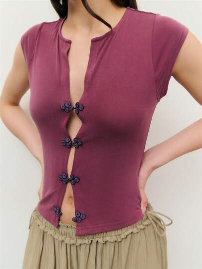 Nöista Sleeve Top In A Soft, Stretchy Jersey With A Clean Round Neckline And Front Slit Opening. Features Decorative Chinese Closures. Perfect For Vacations, Summer Parties, Effortless Daywear, Spring, Music Festival, Beach, Holiday Outfit.