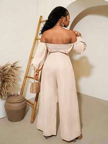 BamGleam Bộ áo liền quần tay phồng, bộ áo liền quần phong cách nghỉ dưỡng năng động với vai bất đối xứng dành cho nữ, quần ống rộng cạp chun màu da, tay cánh hoa trễ vai, bộ áo liền quần bằng satin thanh lịch dành cho công sở và kỳ nghỉ. - Màu be - Xem 2