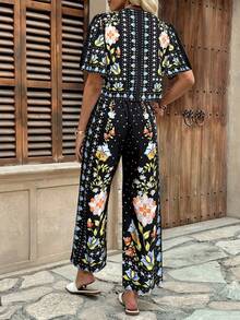 Breezaya Bộ đồ nữ thường ngày gồm áo tay ngắn và quần ống rộng in họa tiết, kiểu dáng boho, thích hợp cho kỳ nghỉ hè. Trang phục mùa hè phong cách boho hoa lá dành cho nữ. - Nhiều màu - Xem 2