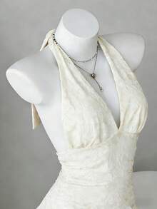 Elamini 2026新款女士夏季优雅连衣裙，甜美露背系带提花设计深V领无袖休闲连衣裙，适合海滩、度假、日常约会、情人节、音乐节、演唱会、派对、演出等场合，杏色。女士夏季连衣裙，夏季女装，度假装，女士度假连衣裙，沙滩派对连衣裙，女士假日服装。 - 杏色 - 查看 1