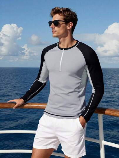 CoralVoy Camiseta de protección solar de manga larga con media cremallera y bloques de color para hombre