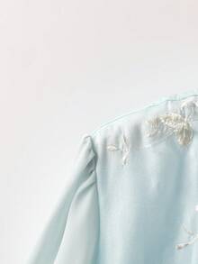 GlowEve CURVE Plus Size Embroidered Tassel Decor Button Cuff Chiffon Embroidered Fabric Elegant Short Sleeve Blouse - Baby Blue - View 4