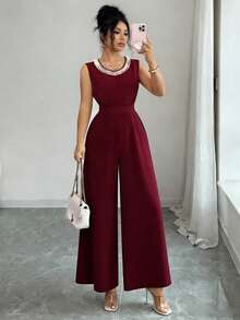 Elenzga Bộ jumpsuit không tay màu đỏ tía thanh lịch, mang phong cách Pháp cổ điển, thiết kế cao cấp, cổ tròn, đính hạt cườm, thắt eo và ống rộng giúp tôn dáng, kiểu dáng sang trọng và đẹp mắt, thích hợp mặc hàng ngày cho phụ nữ. - Màu Đỏ Sâu - Xem 5