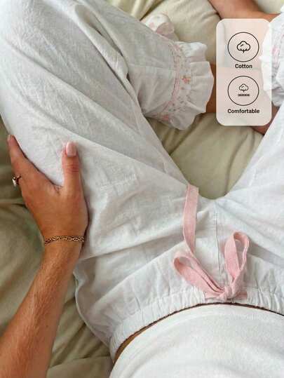 CovetEZ 休闲简约象牙色花卉撞色蝴蝶结装饰花卉灯笼荷叶边下摆女裤