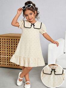 女童杏色和黑色波点印花连衣裙，配以优雅蕾丝领、荷叶边下摆、蝴蝶结装饰和泡泡袖，适合日常穿着，甜美可爱，也适合度假和夏季穿着。 - 杏色 - 查看 7