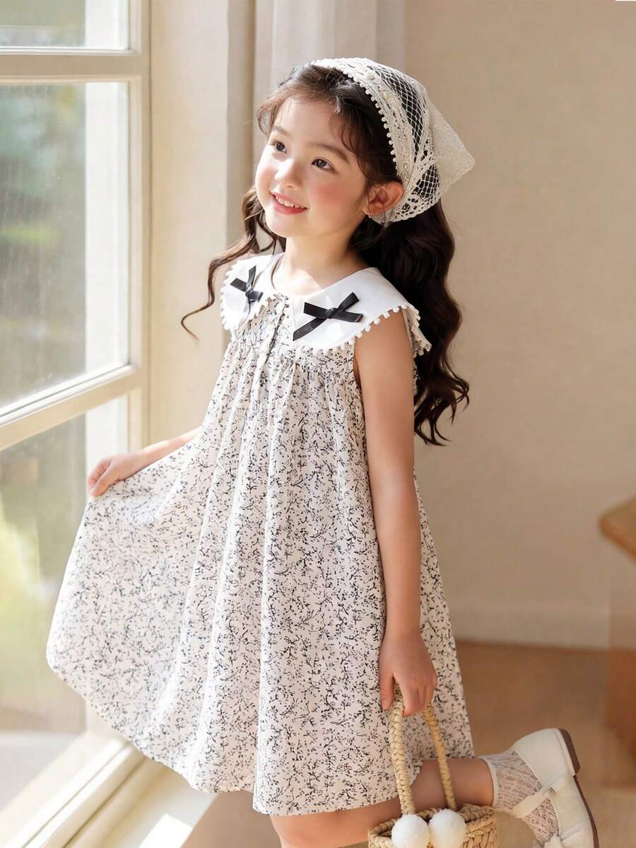 SHEIN Elladie kids Đầm mùa hè cho bé gái, họa tiết hoa nhí dễ thương, nơ ren, cổ Peter Pan, dáng suông, thích hợp mặc hàng ngày, đi nghỉ mát, đi làm, và mang đến vẻ ngoài thanh lịch. - Nhiều màu - Xem 1