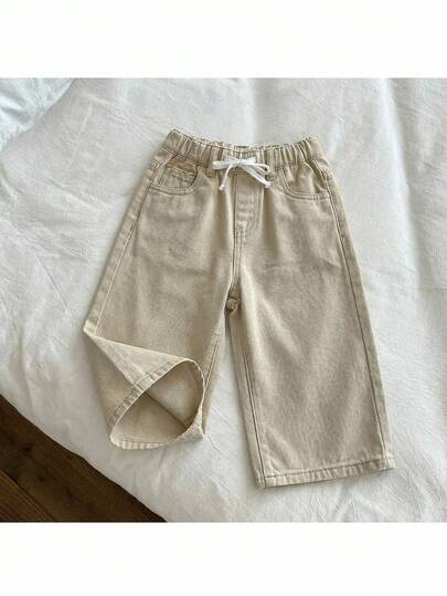 SHEIN Quần jeans ống rộng dáng suông, tối giản, đa năng, màu trơn, cạp chun, thích hợp cho bé trai mặc đi làm hàng ngày.
