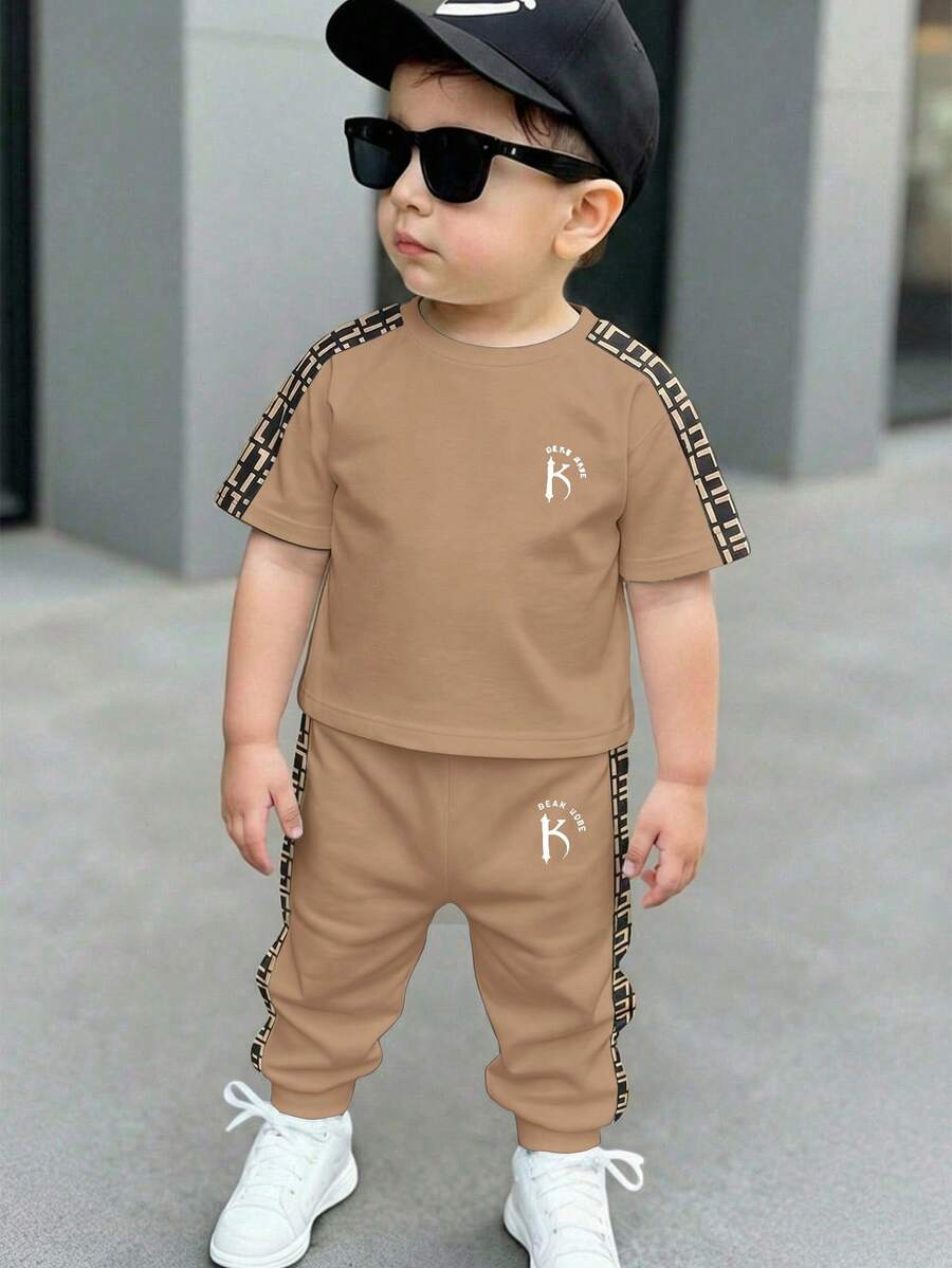 SHEIN Bộ đồ thể thao thoải mái, rộng rãi, cổ tròn, tay ngắn và quần dài cho bé trai, hàng mới về mùa thu. - Nhiều màu - Xem 1
