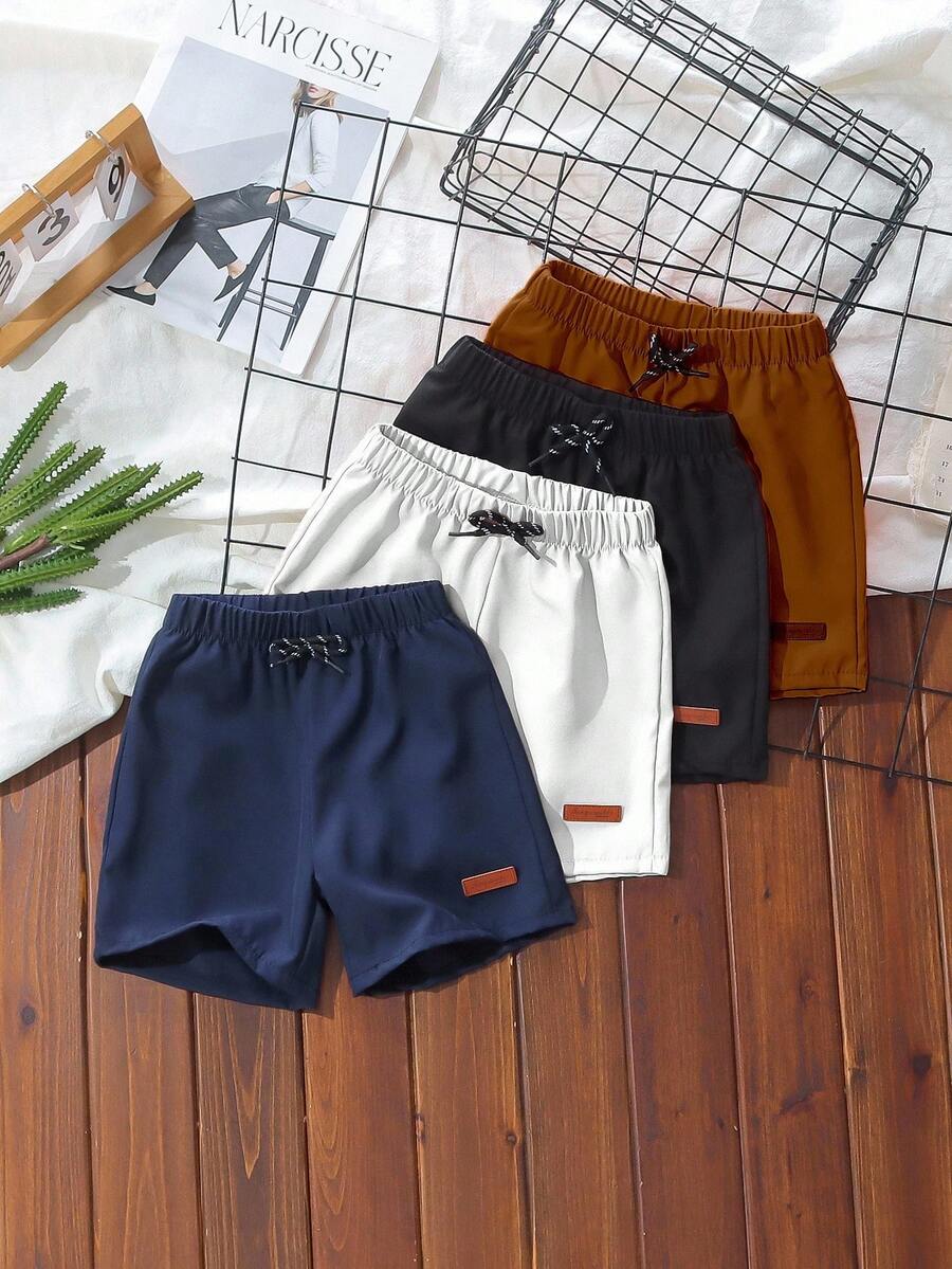 SHEIN Streecool Kids 4件套男童休闲运动学院风街头时尚纯色拼接短裤，适合日常穿着、上学、外出、运动、春夏穿着。为男童提供多种搭配选择和多样化的服装组合。整体设计简约优雅，穿着舒适时尚。 - 彩色 - 查看 1