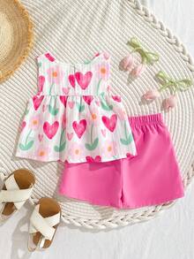 SHEIN Playful Pals Bộ đồ hai mảnh mùa hè cho bé gái gồm áo không tay cổ tròn và quần short màu đỏ. Sự kết hợp màu đỏ và trắng tươi tắn, chất liệu vải dệt, dáng rộng. Kiểu dáng ngọt ngào, thanh lịch và mộc mạc, với họa tiết quả anh đào in khắp nơi, sinh động và dễ thương. Thích hợp cho các hoạt động hàng ngày, đi học, dự tiệc, sinh nhật, du lịch nghỉ mát. - Hồng - Xem 2