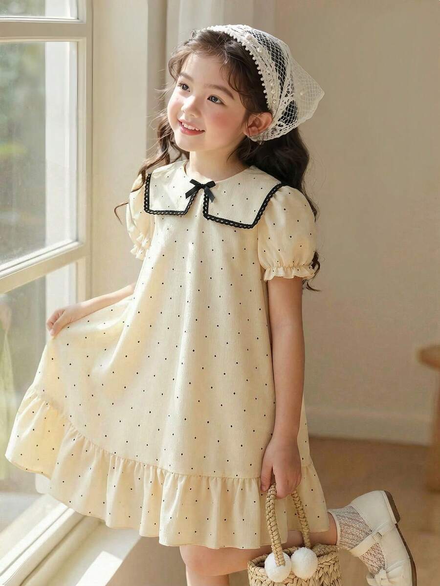 Đầm vải in họa tiết chấm bi đen và màu mơ cho bé gái, cổ ren thanh lịch, viền bèo nhún, điểm nhấn nơ, tay phồng, thích hợp mặc hàng ngày, đi nghỉ mát, mùa hè. - Màu be - Xem 1