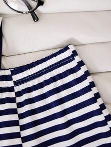 SHEIN Bộ đồ trẻ em Casuvi 2 món gồm áo thun tay ngắn cổ polo kẻ sọc và quần ống rộng dệt kim cho bé gái, phong cách retro Mỹ thường ngày, thích hợp mặc hàng ngày vào mùa xuân/hè. - Màu xanh hải quân - Xem 8