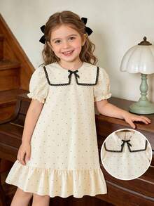 女童杏色和黑色波点印花连衣裙，配以优雅蕾丝领、荷叶边下摆、蝴蝶结装饰和泡泡袖，适合日常穿着，甜美可爱，也适合度假和夏季穿着。 - 杏色 - 查看 1