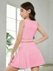 Conjunto de top sem mangas e saia de tênis para meninas pré-adolescentes, cor rosa escuro sólida, minimalista e confortável, ideal para primavera/verão, design esportivo e elegante de cintura alta, ajuste perfeito e que alonga a silhueta, tecido elástico. - Rosa - Ver 2