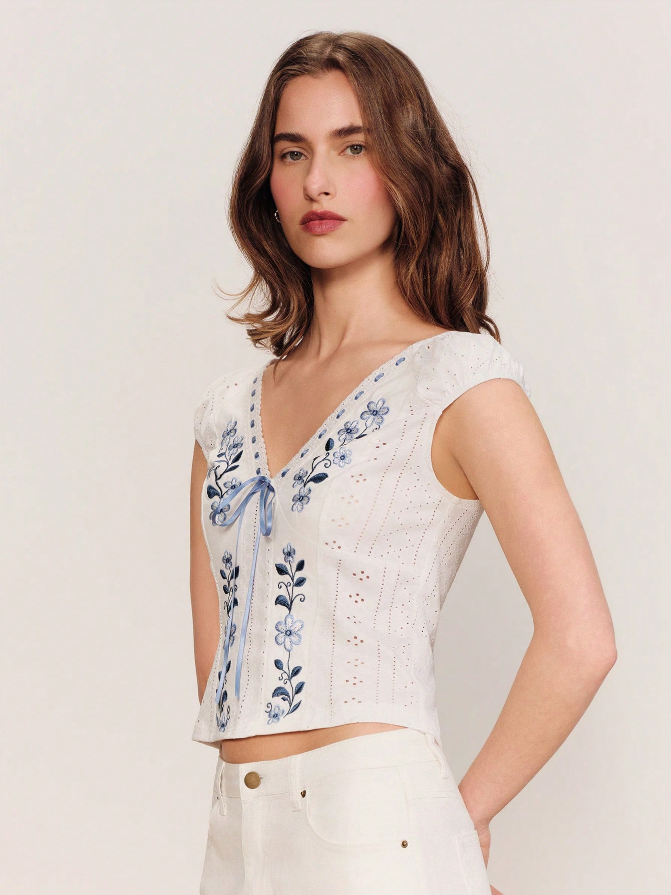 White Broidery Anglais Jersey V Neckline Top With Puff Sleeves And Blue Stitch Spring Summer Outings Spring Summer French Style Parisian Style Vacation Top European Holiday Top Embroidered Top Floral Top White Top V-Neck Top