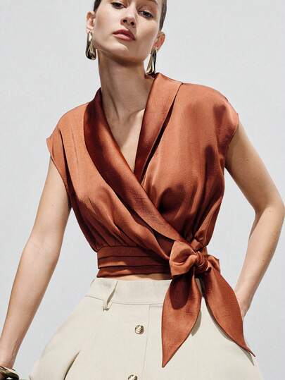 Aveloria Modichic Brick Red, 3D Textured, Wide Lapel, V-Neck Wrap Design, Waist Tie Cinched, Slightly Oversized Sleeveless, Soft Drapey Fabric, Modern Elegant Style, Suitable For Urban Casual, Formal Evenings, Art Exhibitions, Vacation Looks, Fashion Gatherings, Showcasing Refined Silhouette And Layering. Sophisticated Vibe, Crossover V-Neck, Stylish Slimming, Unique Versatile Commute Bow Tie Blouse For Women