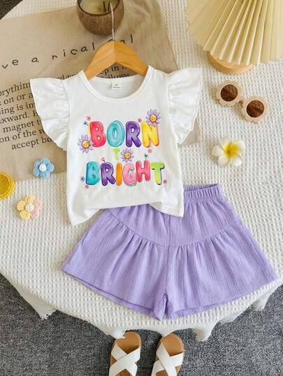 SHEIN Bộ 2 món cho bé gái gồm áo thun cổ tròn tay phồng + khẩu hiệu cầu vồng "Born Bright" + họa tiết hoa + quần short xếp lớp có dây rút, trang phục mùa hè rực rỡ và thoải mái cho các hoạt động ngoài trời, mặc hàng ngày và các buổi gặp gỡ thường ngày.