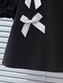 Genkimix Kids Bộ đồ thời trang cho bé gái gồm áo kiểu tay cánh hoa đính nơ, cổ tròn và quần dài thoải mái. - Nhiều màu - Xem 3