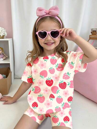 SHEIN 2pcs/Set Young Girl Casual Loose Face, Strawberry & Flower Print Round Neck Short Sleeve T-Shirt And Tight Fitting Cycling Shorts, Suitable For Spring/Summer Daily Wear, Street Style, Vacation, Outdoor, Sports, Holiday