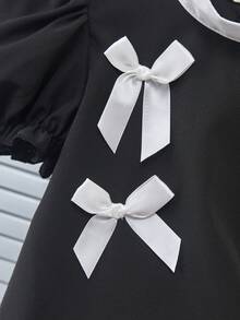 Genkimix Kids Bộ đồ thời trang cho bé gái gồm áo kiểu tay cánh hoa đính nơ, cổ tròn và quần dài thoải mái. - Nhiều màu - Xem 8