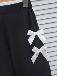 Genkimix Kids Bộ đồ thời trang cho bé gái gồm áo kiểu tay cánh hoa đính nơ, cổ tròn và quần dài thoải mái. - Nhiều màu - Xem 5