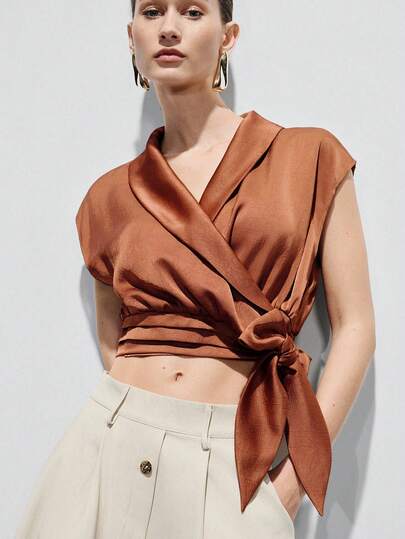 Aveloria Modichic Brick Red, 3D Textured, Wide Lapel, V-Neck Wrap Design, Waist Tie Cinched, Slightly Oversized Sleeveless, Soft Drapey Fabric, Modern Elegant Style, Suitable For Urban Casual, Formal Evenings, Art Exhibitions, Vacation Looks, Fashion Gatherings, Showcasing Refined Silhouette And Layering. Sophisticated Vibe, Crossover V-Neck, Stylish Slimming, Unique Versatile Commute Bow Tie Blouse For Women