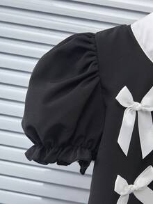 Genkimix Kids Bộ đồ thời trang cho bé gái gồm áo kiểu tay cánh hoa đính nơ, cổ tròn và quần dài thoải mái. - Nhiều màu - Xem 6