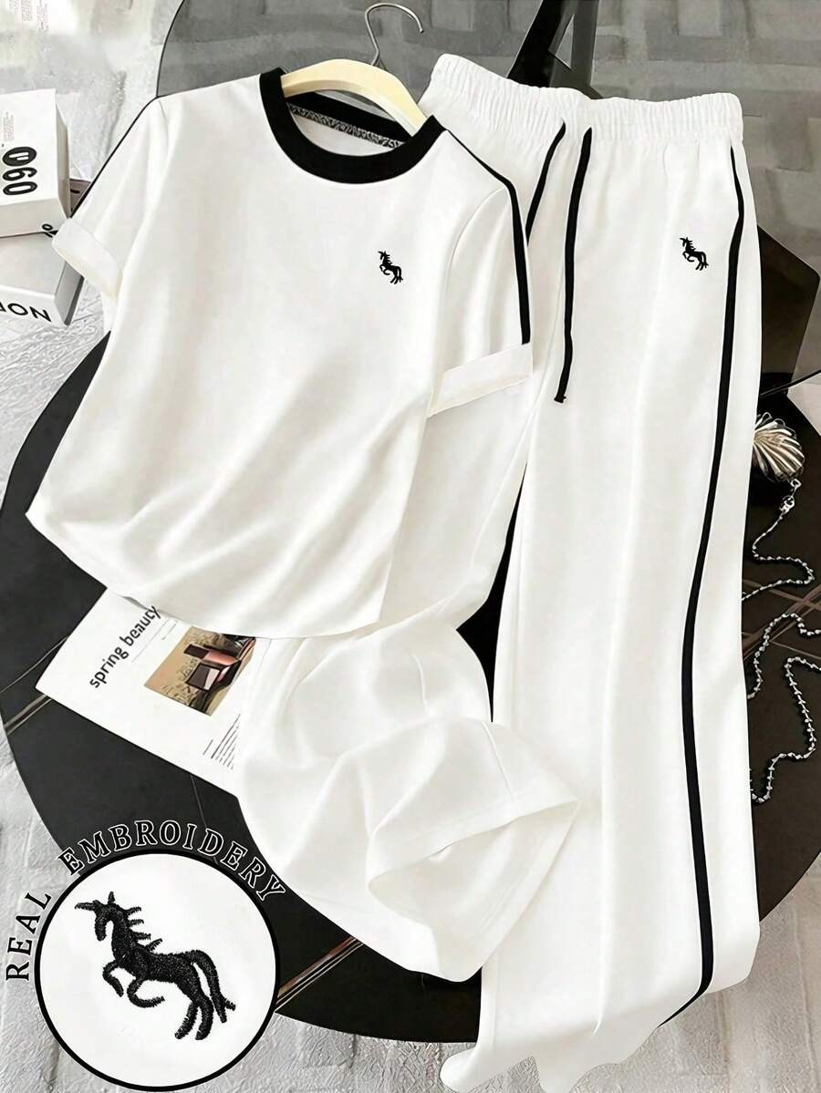 GlowEve CURVE Plus Size Women 2pcs Women's Fashion Round Neck Embroidered Print Contrast Trim T-Shirt, Casual Elastic Waist Embroidered Wide Leg Pants Set - White - View 1