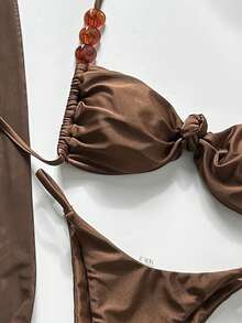 Sirith Bộ bikini 3 món Swim Oasis mùa xuân & hè, họa tiết ngẫu nhiên, màu cà phê, thiết kế bất đối xứng đính ngọc trai, gồm áo quây, quần và váy xếp ly phía trước, gợi cảm dành cho nữ. - Cà phê nâu - Xem 4