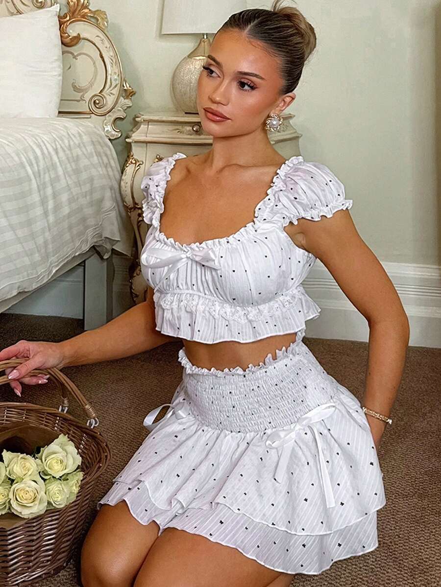 SHEIN Bộ đồ nữ gồm áo croptop tay phồng in họa tiết nơ và chân váy mini chữ A cạp cao, thích hợp cho kỳ nghỉ xuân/hè trên đảo, dã ngoại, tiệc trà chiều. - trắng - Xem 1