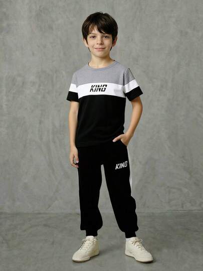 SHEIN Casuvi Kids Young Boy Letter Print Round Neck Short Sleeve T-Shirt And Shorts Casual Outfit