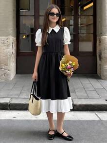 Este vestido juvenil de una pieza presenta un estilo elegante y de moda con un pequeño escote en V, mangas abullonadas, una cintura ajustada y una amplia silueta A-line. - Blanco y Negro - Ver 1