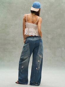 Bohemela Quần dài nữ phong cách Bohemian mùa hè giản dị và thoải mái, hoàn hảo cho thời trang đường phố, kỳ nghỉ và các lễ hội âm nhạc miền Tây. Thiết kế lấy cảm hứng từ phong cách Bohemian với chất liệu denim xanh cổ điển và hiệu ứng mài mòn retro, chiếc quần dài denim này được điểm xuyết bằng các mảng vải họa tiết Paisley. - Màu xanh lam - Xem 8