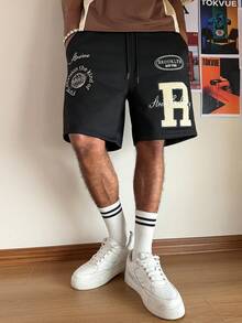 PAVTROS Men's Casual Letter Print Slant Pocket Loose Shorts - Black - View 1