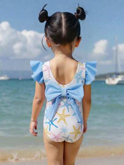 SHEIN Bộ áo liền quần không tay cho bé gái, họa tiết sao biển phối màu tương phản với nơ lớn, chất liệu mềm mại, cổ tròn, viền bèo nhún, thích hợp cho kỳ nghỉ hè hoặc đi biển.