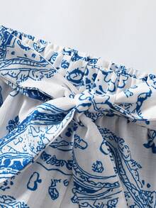 GlowEve 夏季新品：休闲裤、度假裤、佩斯利花纹和腰果花图案、蝴蝶结腰带、阔腿裤。女士蓝白印花裤、度假裤、夏季裤、休闲裤、阔腿裤 - 藍白色 - 查看 9