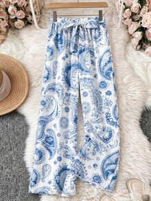 GlowEve 夏季新品：休闲裤、度假裤、佩斯利花纹和腰果花图案、蝴蝶结腰带、阔腿裤。女士蓝白印花裤、度假裤、夏季裤、休闲裤、阔腿裤 - 藍白色 - 查看 6