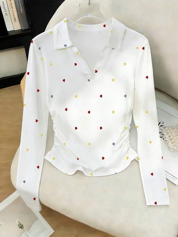 Resyla Sweet Heart Print, Polo Collar, Fitted Waist, Women's Long-Sleeve White T-Shirt. Perfect Outfit For Autumn. New Fashion T-Shirt. Holiday Gift, Sibling Gift, Sister Gift, Mom Gift, Mother's Day Gift. Casual, Minimalist, Fashionable Top.