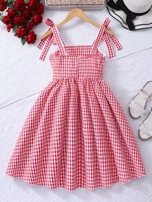 SHEIN 这款少女清新黄色格子吊带连衣裙采用黄白小格子面料，搭配方领和蝴蝶结肩带，尽显法式甜美风情。收腰设计和A字裙摆，既贴身又不失休闲感。这是一款深受女性喜爱的精致连衣裙，适合夏季日常穿着。 - 紅色 - 查看 3