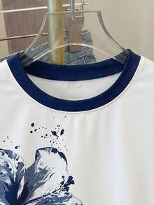 SHEIN Este mono de camiseta casual para niñas preadolescentes presenta una impresión única en el pecho que irradia un ambiente, un cuello redondo contrastante y detalles recogidos en la cintura para un ajuste favorecedor. La tela es elástica, cómoda y transpirable, lo que la hace adecuada para el uso diario, los deportes, las vacaciones, la escuela y otras ocasiones. Es un elemento esencial de verano de alta calidad y versátil. - Blanco - Ver 5