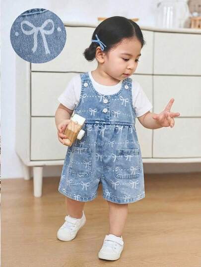 Bộ áo liền quần denim xanh dáng rộng màu trắng có nơ cho bé gái