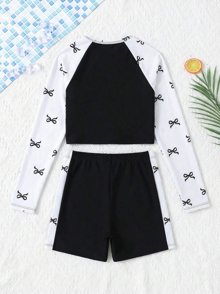 SHEIN Conjunto de traje de baño con top de manga raglán y estampado de plantas tropicales, y shorts para niña preadolescente - Blanco y Negro - Ver 1