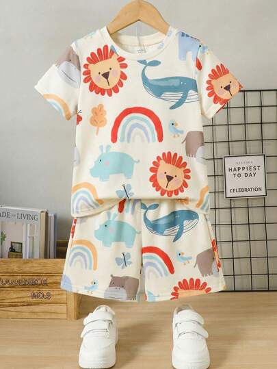 SHEIN Bộ đồ ngủ 2 mảnh in hình cún con dễ thương dành cho bé trai, cổ tròn, tay ngắn và quần short, chất liệu dệt kim, thích hợp cho mùa hè.