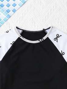 SHEIN Bộ đồ bơi cho bé gái tuổi teen, gồm áo tay raglan in hình cây nhiệt đới và quần short. - Đen và trắng - Xem 7