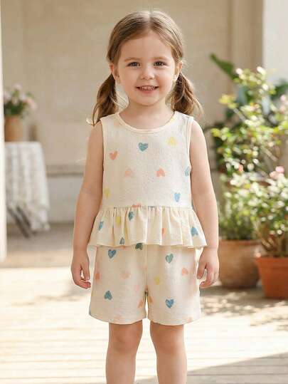 SHEIN Genkimix Kids Bộ đồ hè dễ thương, ngọt ngào, tươi tắn cho bé gái 4-7 tuổi, gồm áo không tay xếp ly hình trái tim nhiều màu sắc in họa tiết bong bóng và quần short cùng họa tiết. Chất liệu cotton pha mềm mại, nhẹ, thân thiện với da, thích hợp cho hoạt động ngoài trời mùa hè và mặc hàng ngày.