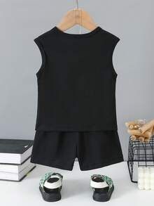 Bộ đồ thường ngày cho bé trai gồm áo cổ tròn và quần short in hình mặt cười. - màu đen - Xem 2