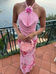 SHEIN Glamour 性感度假风针织露背吊带短款上衣，饰有3D立体花卉图案，凸显肩颈线条，适度露肤，魅力十足；高腰鱼尾裙，贴合腰臀，拉长腿部线条。女士两件套，适合日常约会、海滩度假、生日派对、朋友聚会等场合。可单穿，也可搭配开衫打造日常造型——不规则花卉镂空设计 - 粉色 - 查看 3